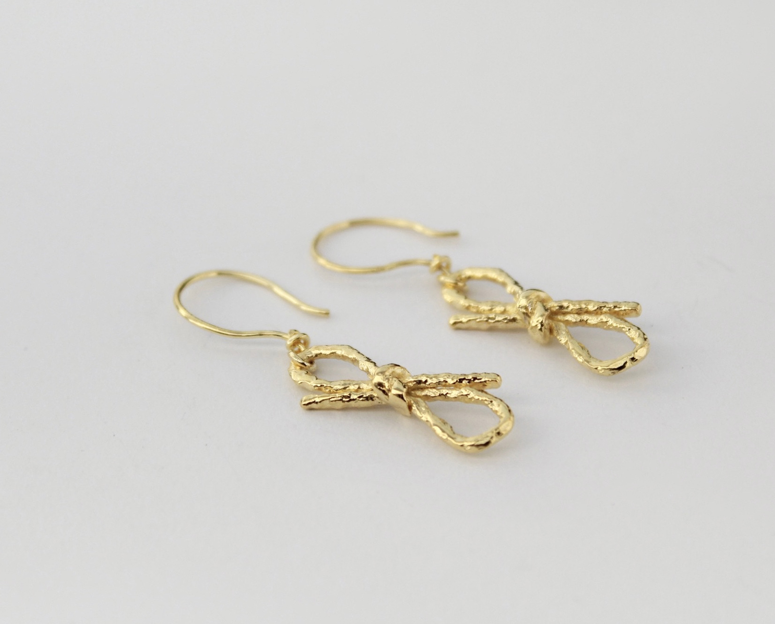 vertical bow earrings - adriana guelfi herrera - jeweller by nature